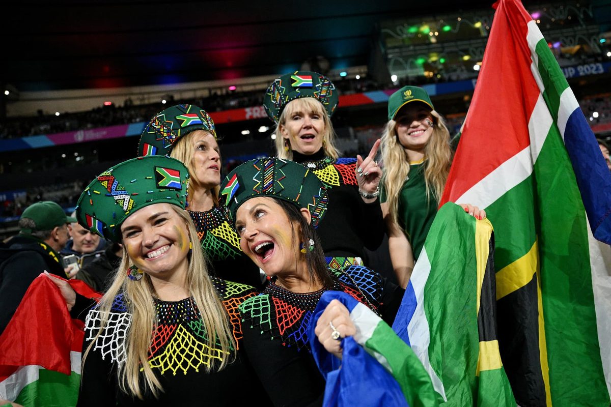 Springbok fans celebrating with South Africa flags on finals night